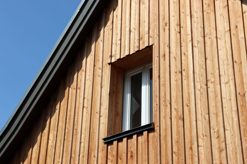 Wooden,Facade,Of,A,Detached,House,With,Window,,Germany