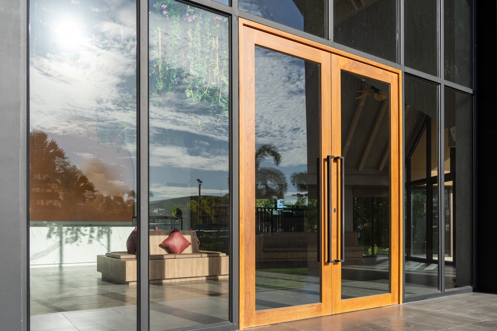 Glass,Door,Entrance,To,A,Large,Apartment,Hotel,,The,Material